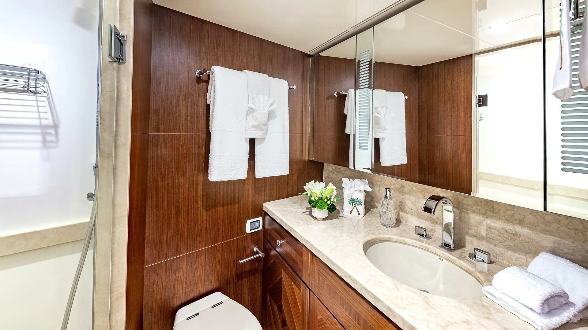 a bathroom with a sink and a mirror aboard BRAVO ZULU II Yacht for Sale