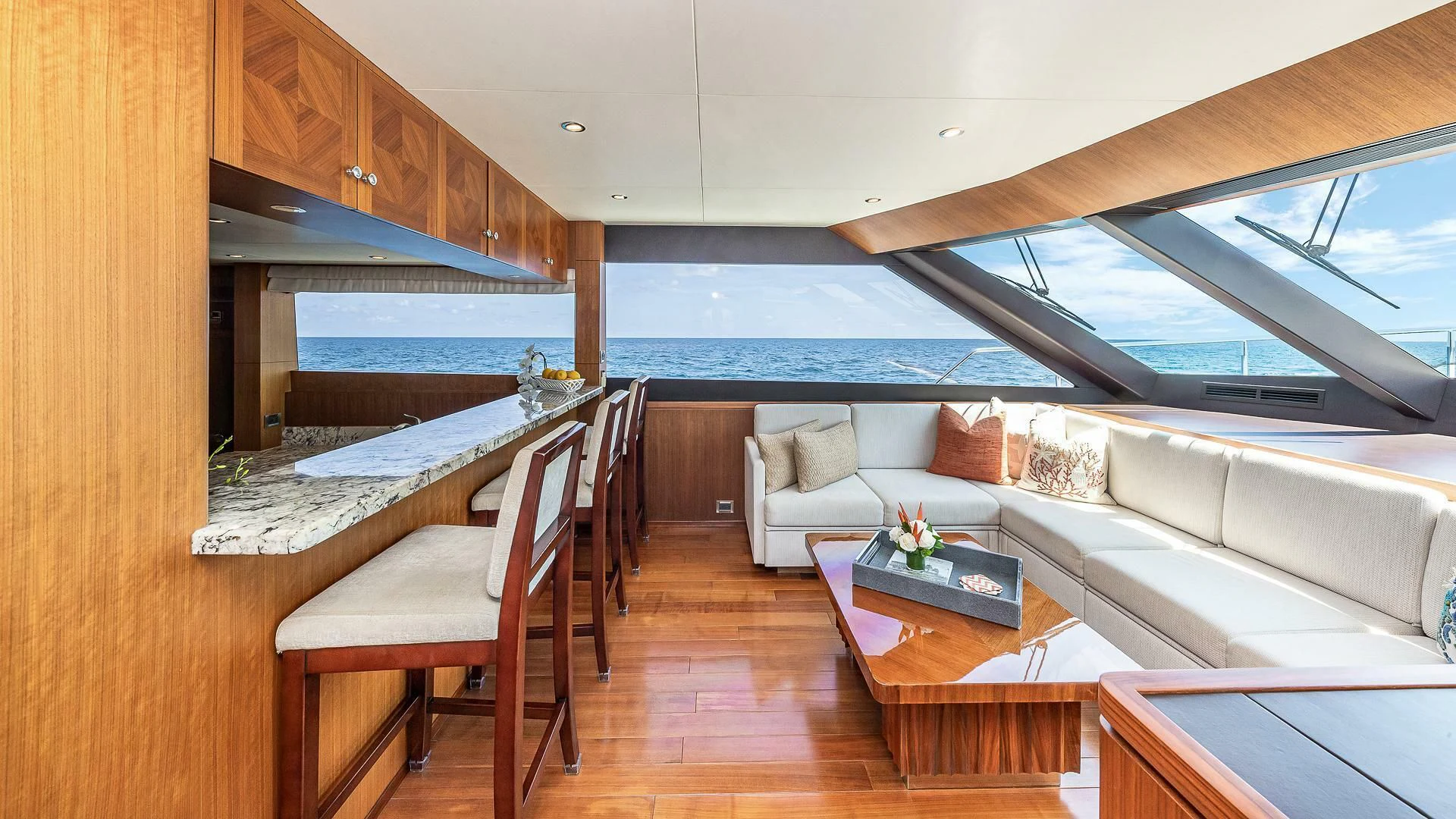 a living room with a couch and a table aboard BRAVO ZULU II Yacht for Sale