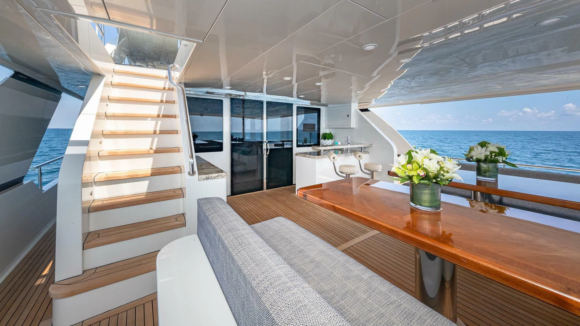 a room with a table and chairs aboard BRAVO ZULU II Yacht for Sale