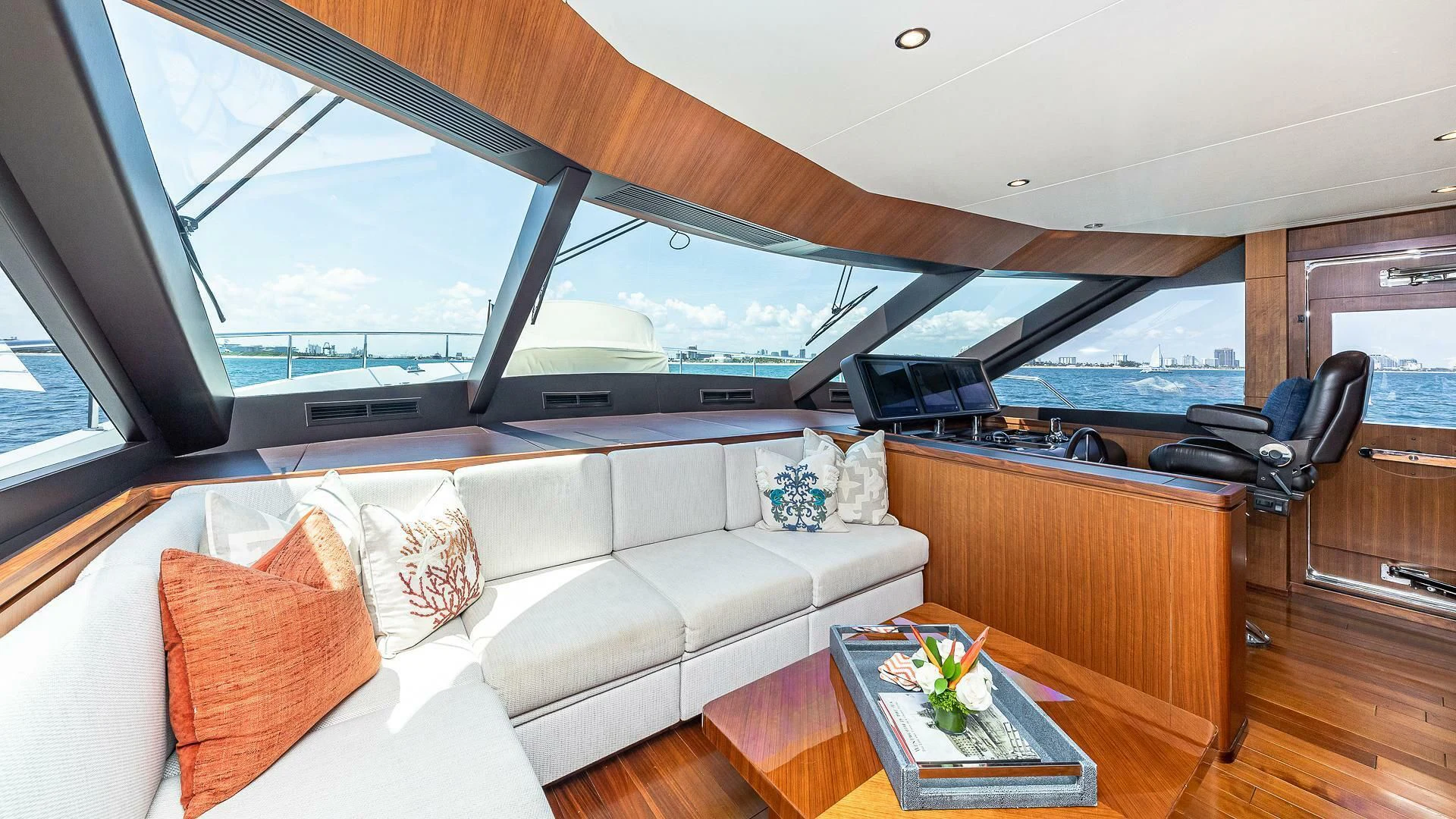 a living room with a couch and a table aboard BRAVO ZULU II Yacht for Sale