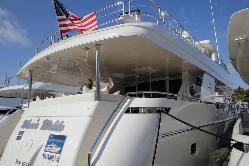 a boat with a flag on the front aboard BRAVO ZULU II Yacht for Sale