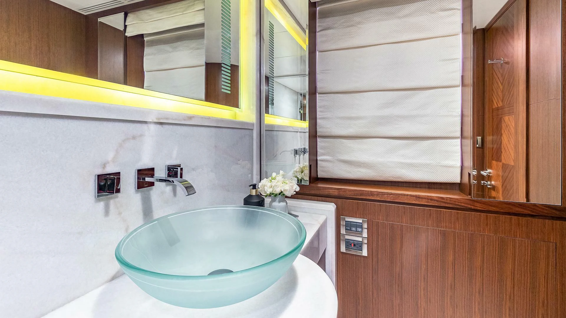 a bathroom with a sink and cabinets aboard BRAVO ZULU II Yacht for Sale