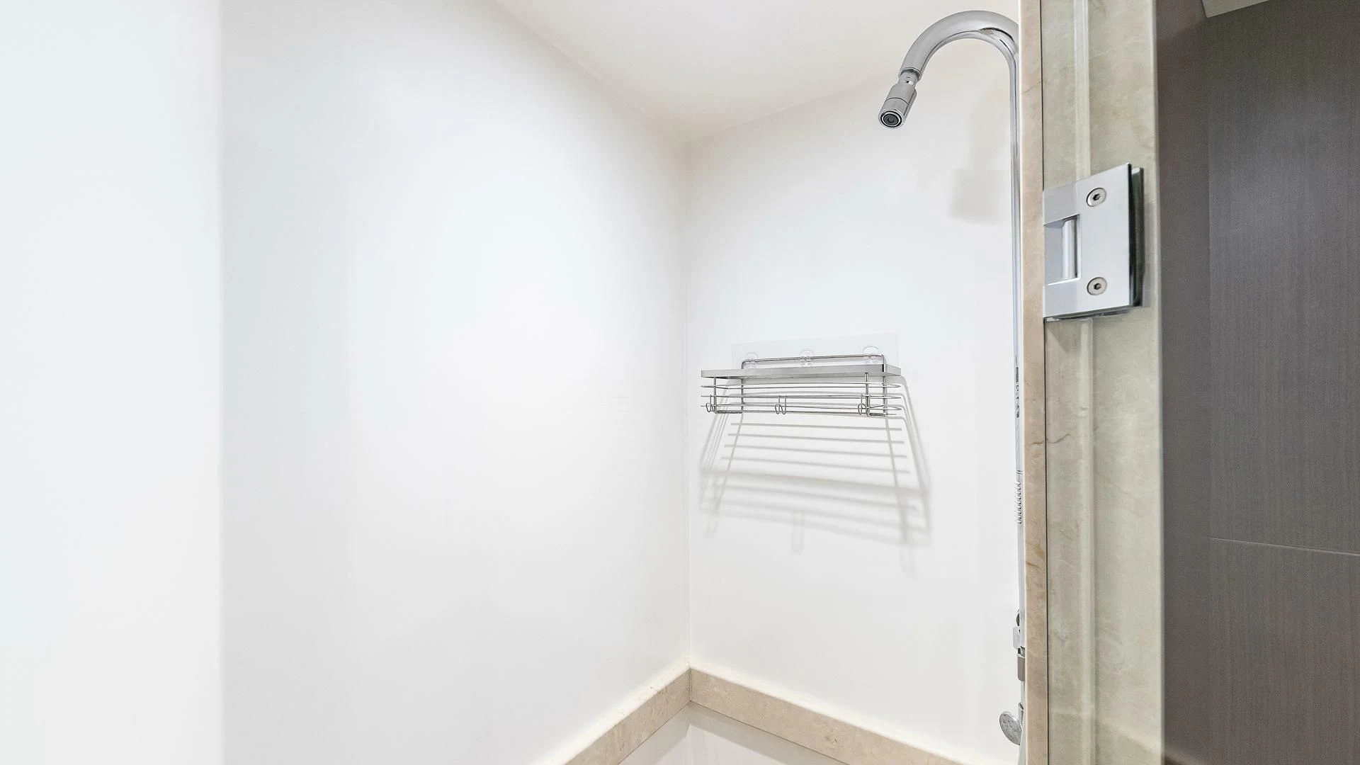 a shower with a white wall aboard BRAVO ZULU II Yacht for Sale