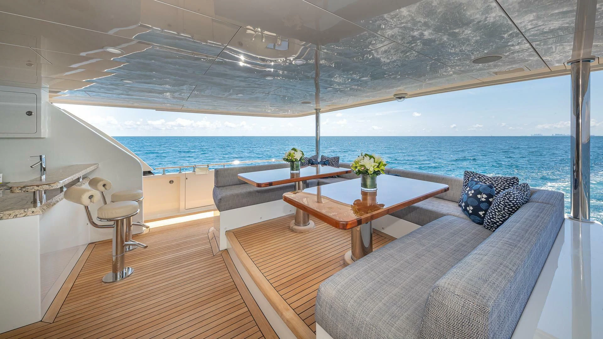a room with a table and chairs aboard BRAVO ZULU II Yacht for Sale