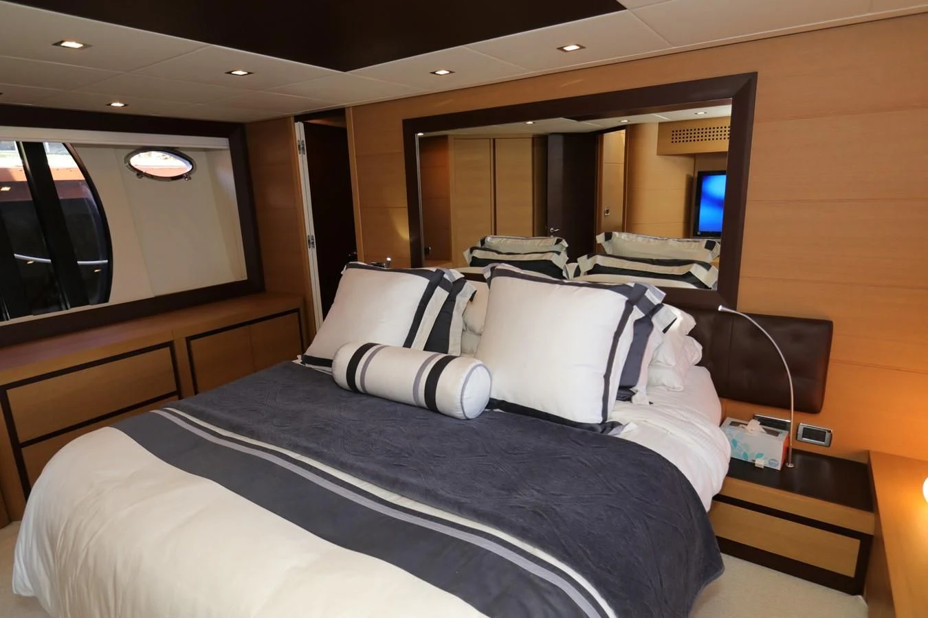 a bed with white pillows aboard VANTAGE Yacht for Charter