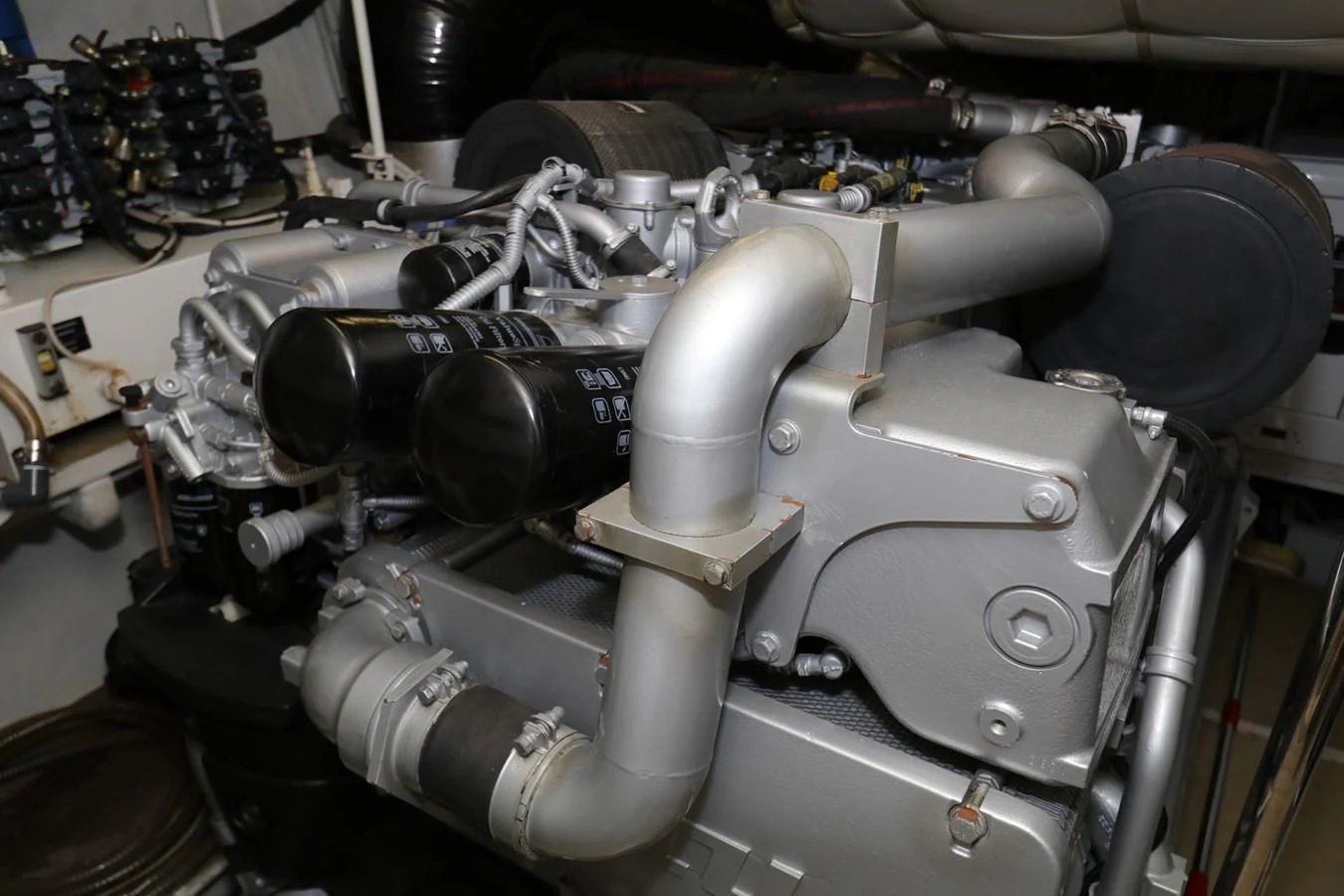 a car engine with a hood aboard VANTAGE Yacht for Charter