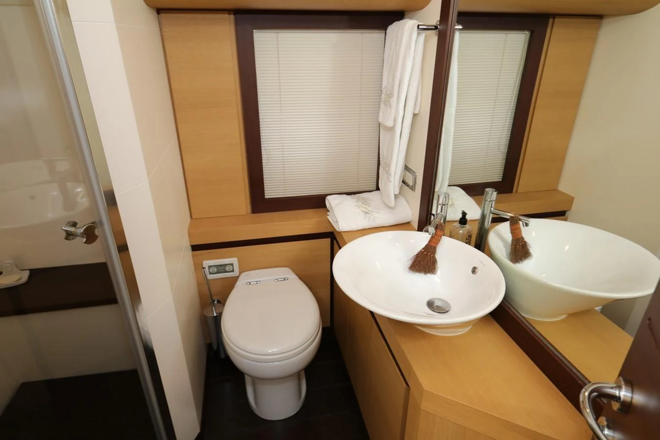 a bathroom with a sink toilet and a bathtub aboard VANTAGE Yacht for Charter