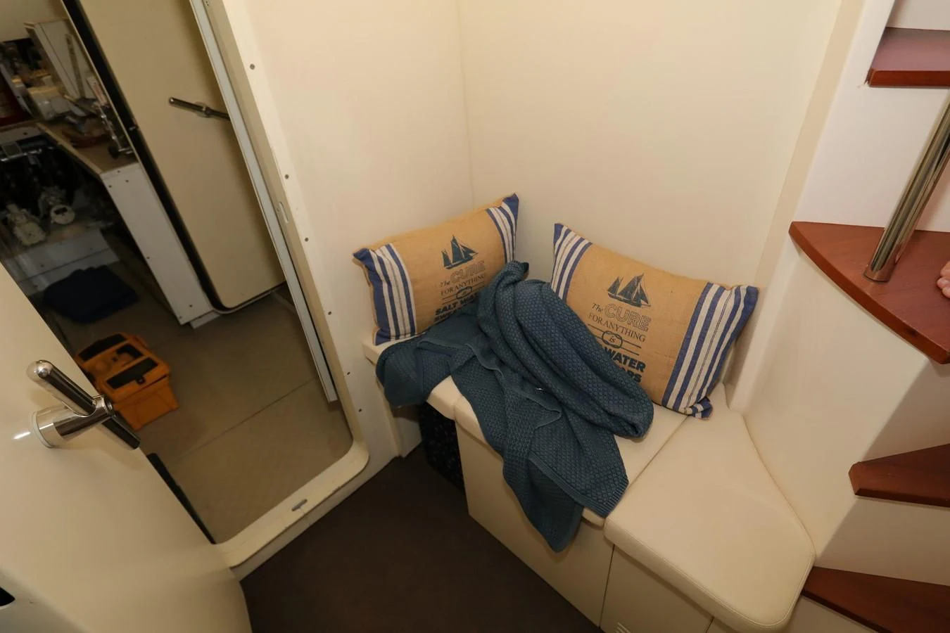 a room with a chair and a table aboard VANTAGE Yacht for Charter