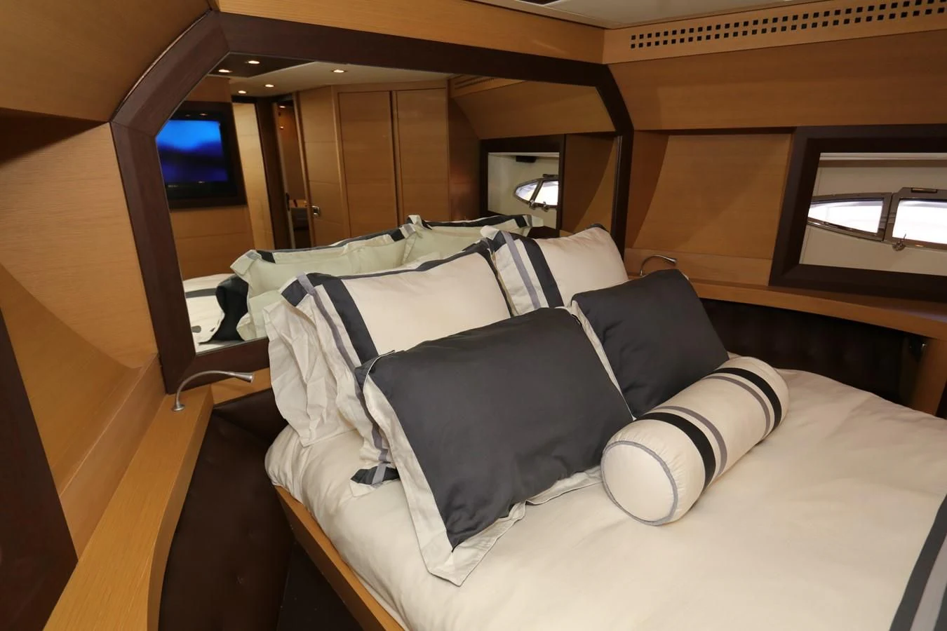 a bed with pillows aboard VANTAGE Yacht for Charter