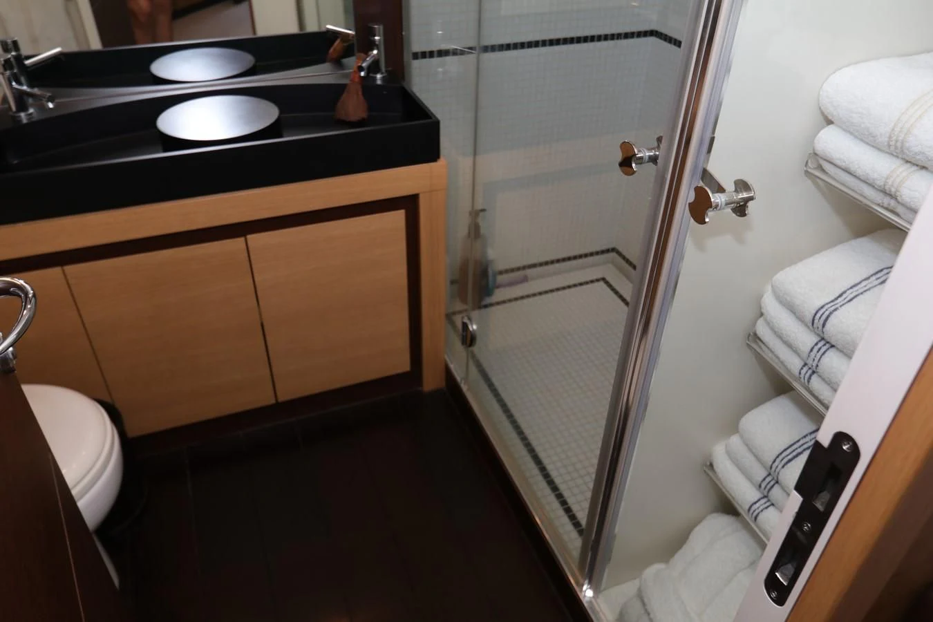 a bathroom with a sink and a shower aboard VANTAGE Yacht for Charter