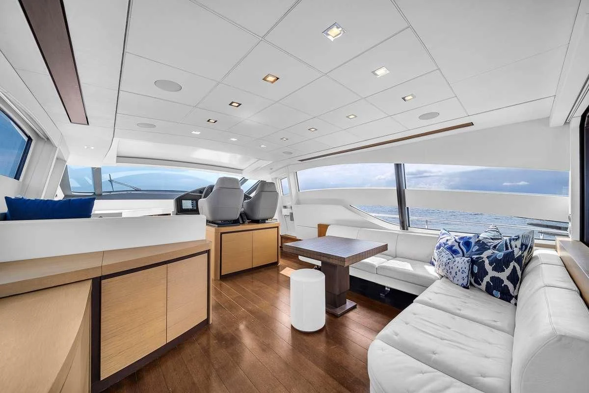 a room with a view of the ocean and the deck aboard VANTAGE Yacht for Charter