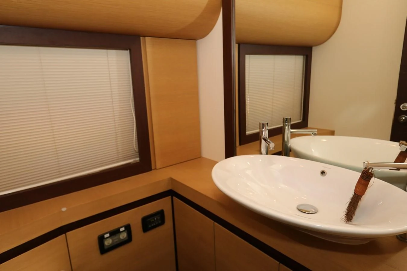 a bathroom with a sink and a mirror aboard VANTAGE Yacht for Charter