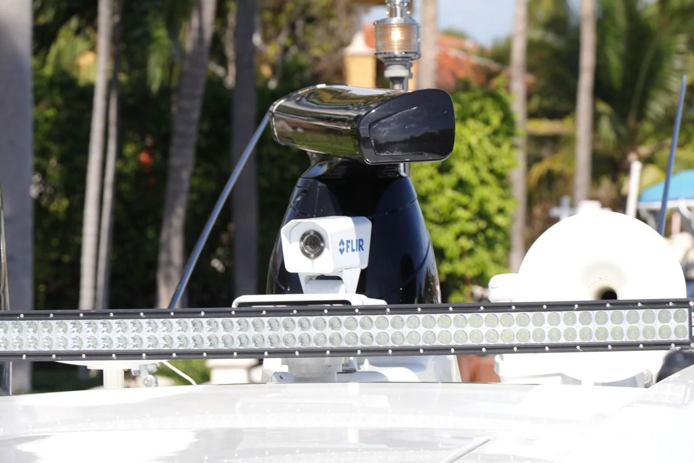 a person wearing a helmet and holding a bike aboard VANTAGE Yacht for Charter
