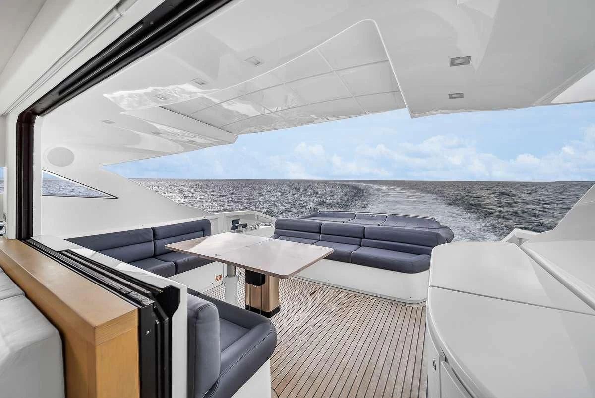 a boat with a view of the ocean and the land below aboard VANTAGE Yacht for Charter
