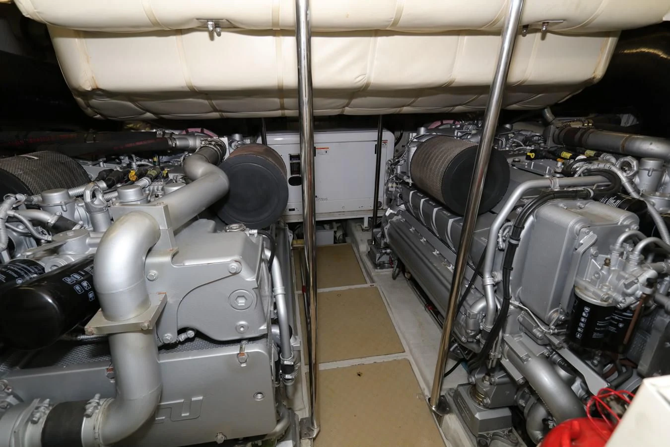 a car engine with a large pipe aboard VANTAGE Yacht for Charter