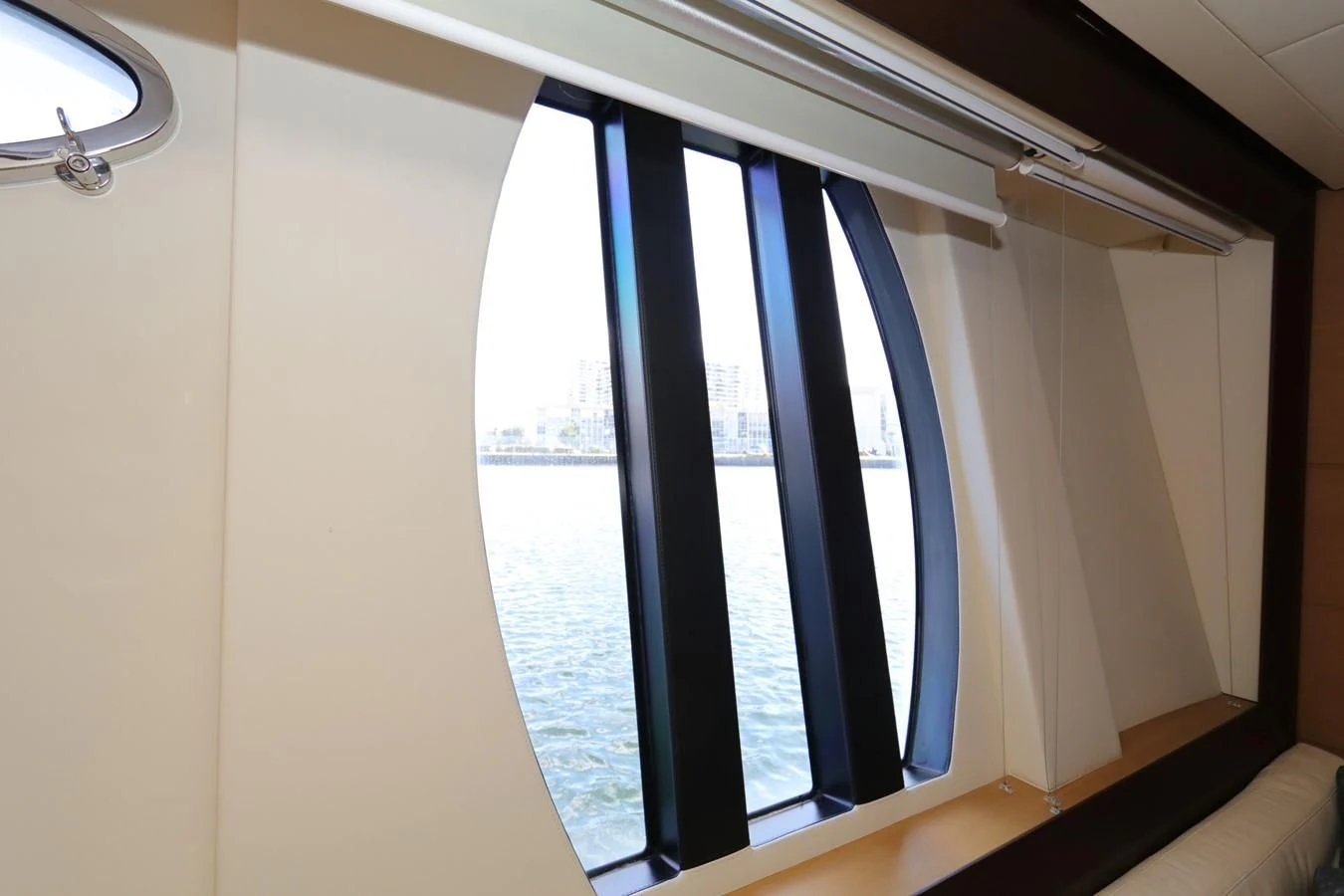 a window with a view of the city aboard VANTAGE Yacht for Charter