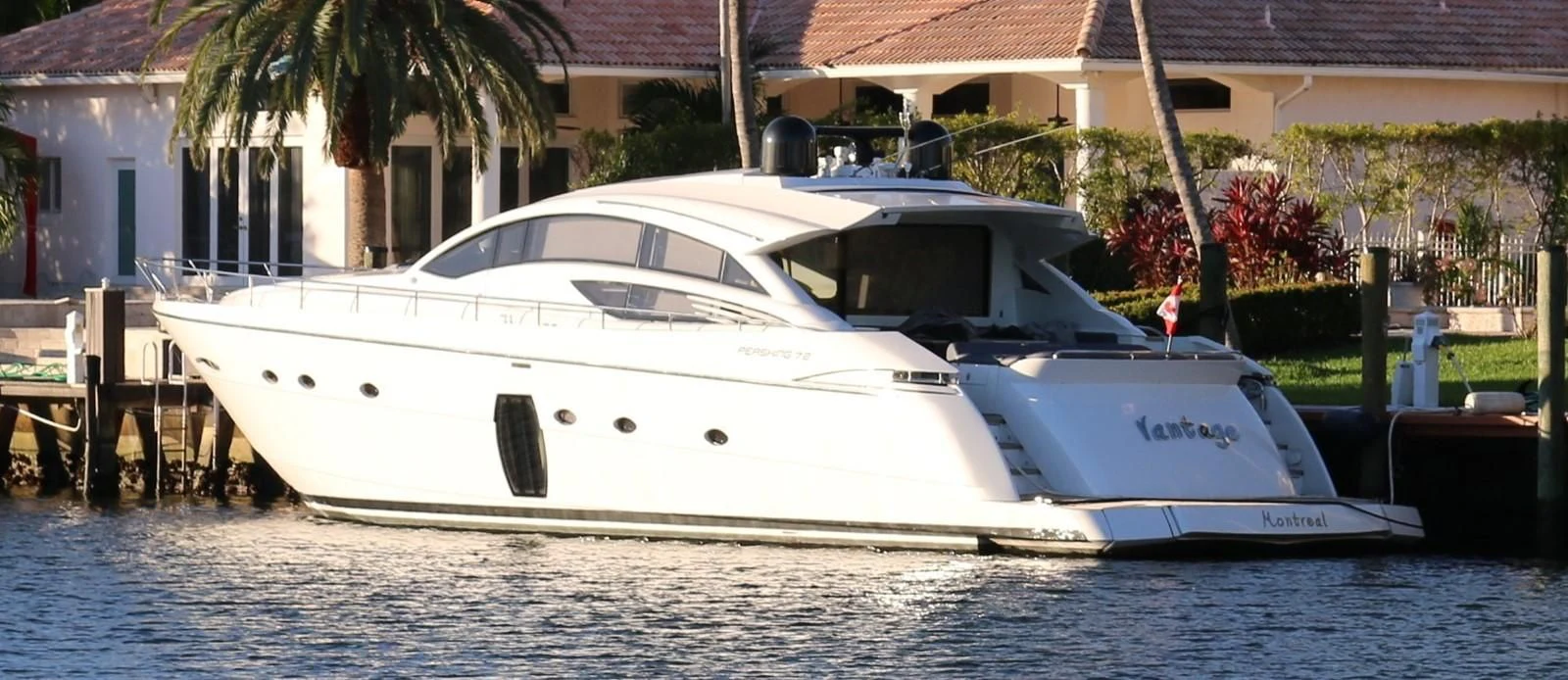 a white boat on the water aboard VANTAGE Yacht for Charter