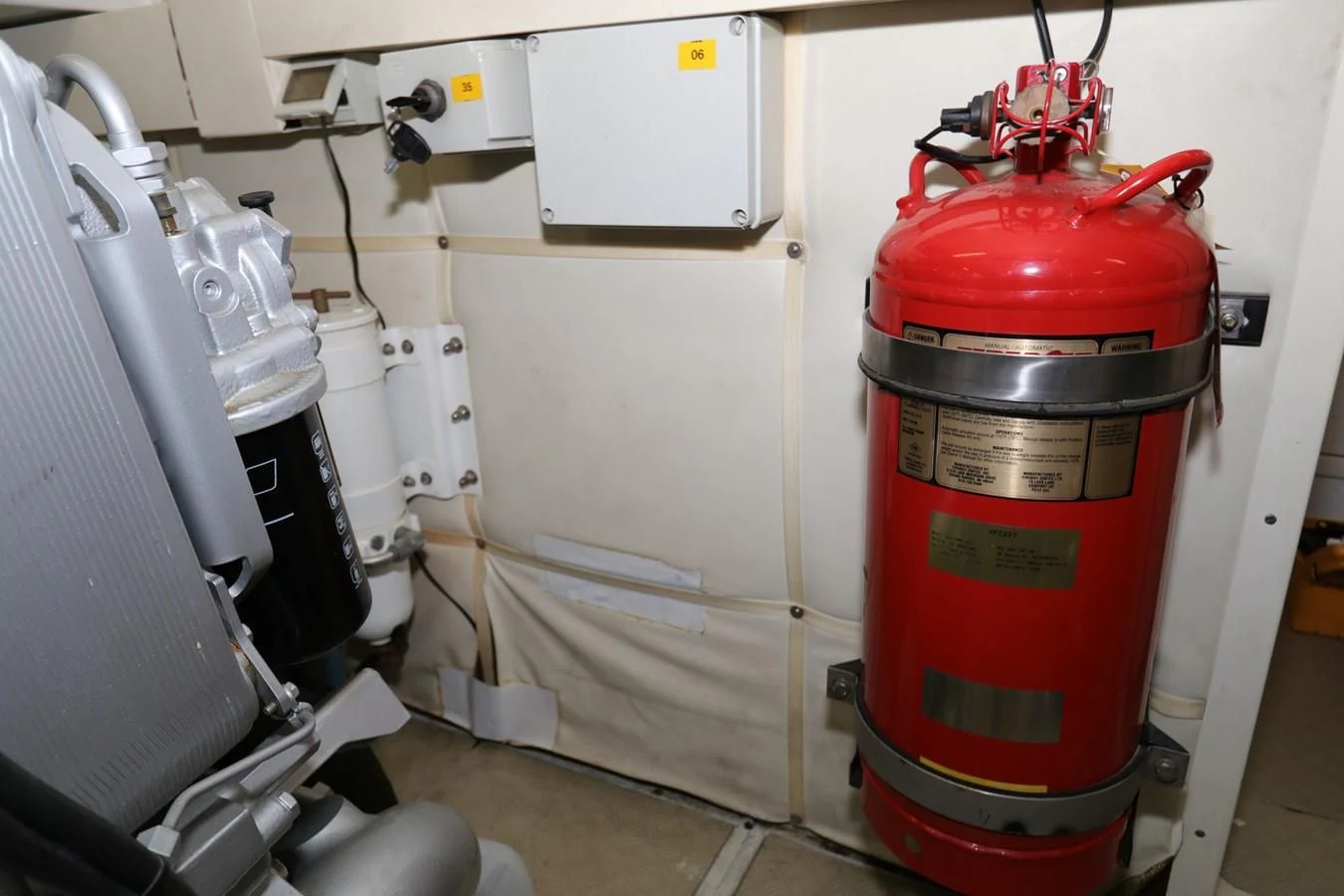 a red and white machine aboard VANTAGE Yacht for Charter