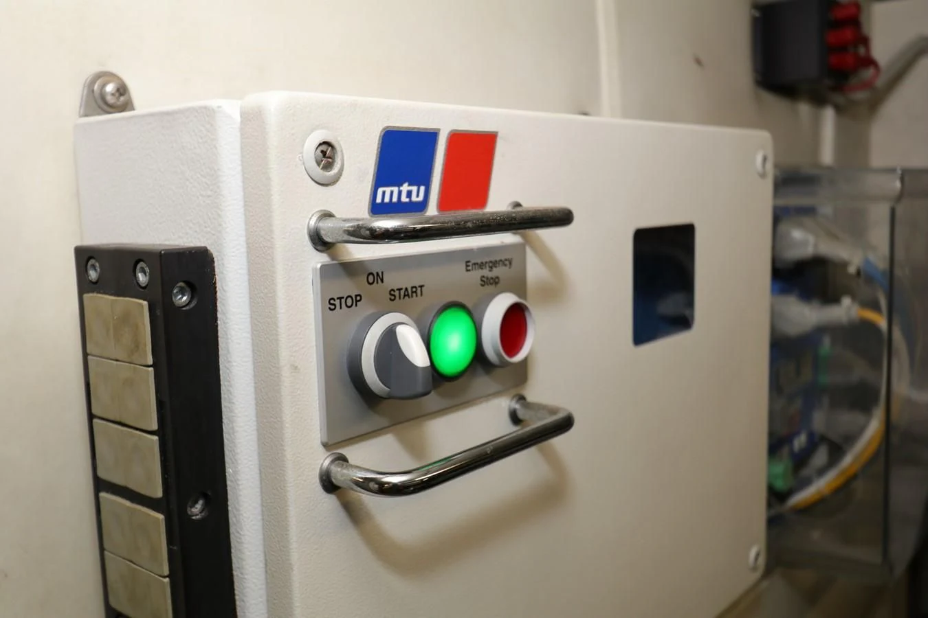 a machine with buttons and a screen aboard VANTAGE Yacht for Charter