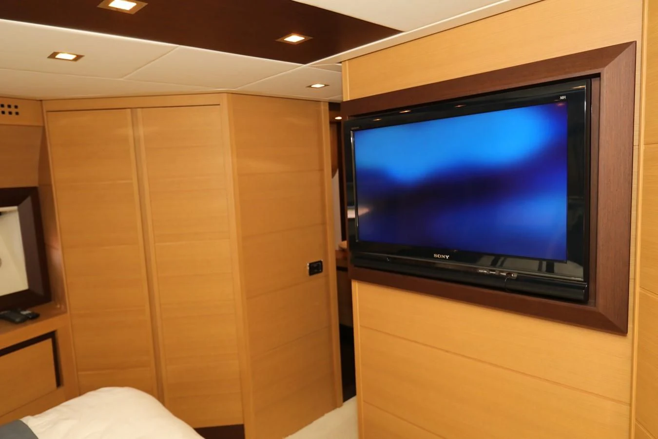 a tv on a wall aboard VANTAGE Yacht for Charter