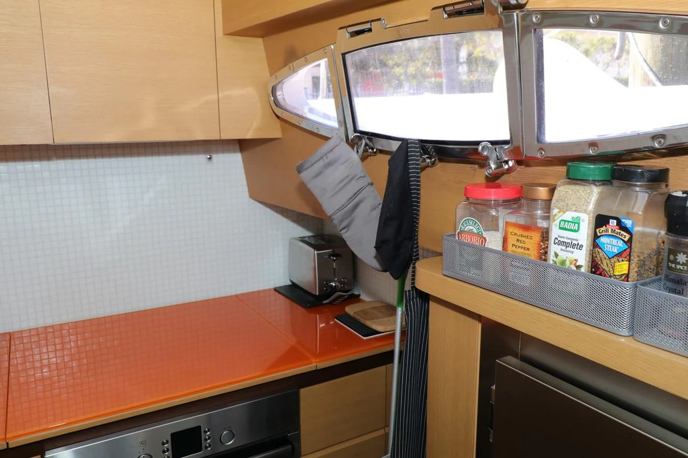 a person standing at a counter aboard VANTAGE Yacht for Charter
