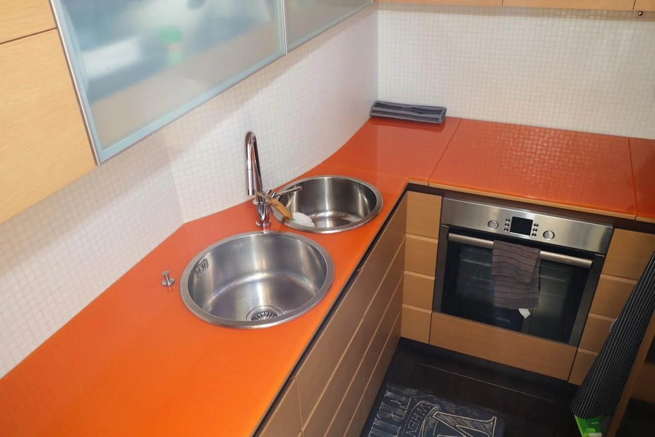 a kitchen with a sink and microwave aboard VANTAGE Yacht for Charter
