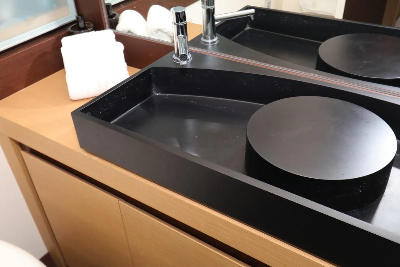 a black sink with a black faucet aboard VANTAGE Yacht for Charter