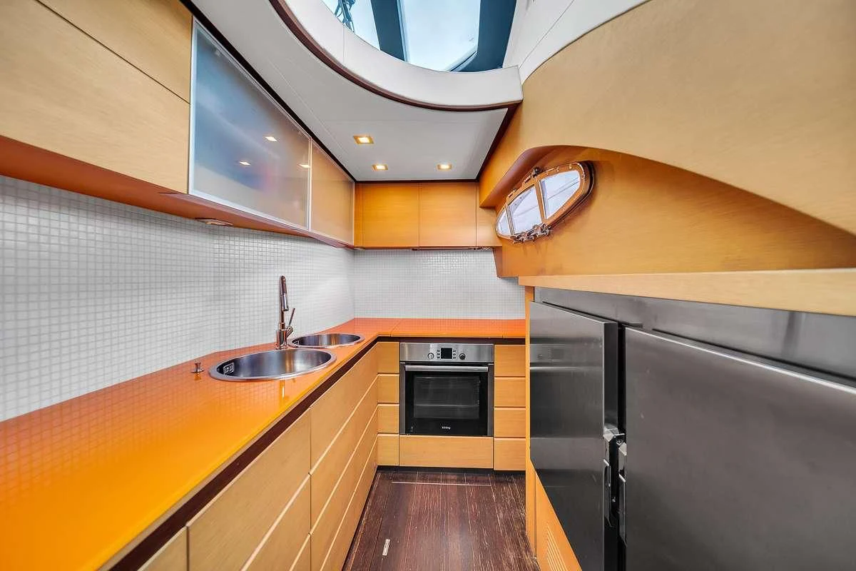 a kitchen with a sink and stove aboard VANTAGE Yacht for Charter