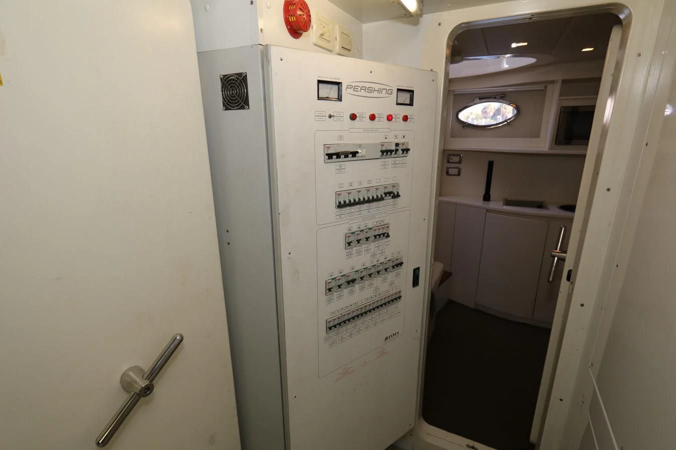 a white refrigerator in a room aboard VANTAGE Yacht for Charter