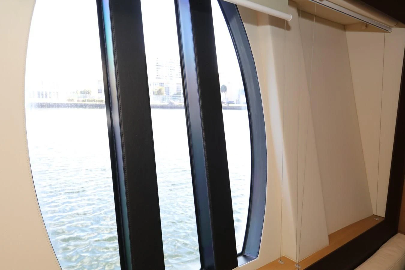 a window with a view of a body of water aboard VANTAGE Yacht for Charter