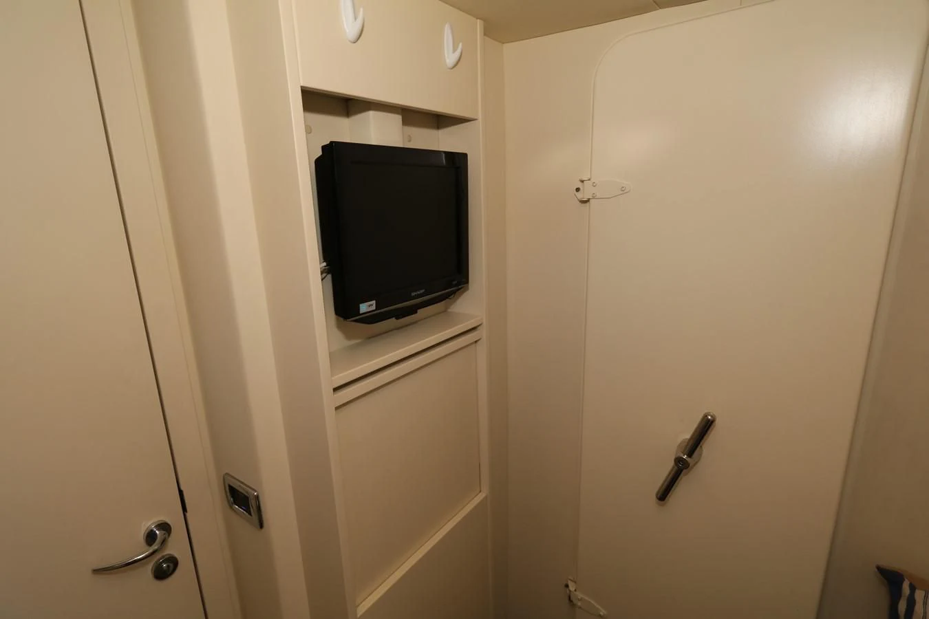 a tv mounted on a wall aboard VANTAGE Yacht for Charter