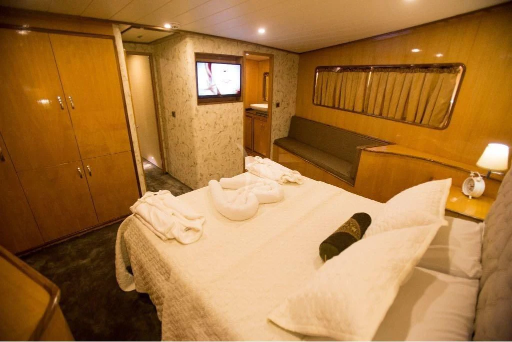 a hotel room with a bed aboard SIMAY S Yacht for Sale
