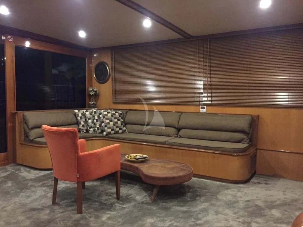 a living room with a couch and a coffee table aboard SIMAY S Yacht for Sale