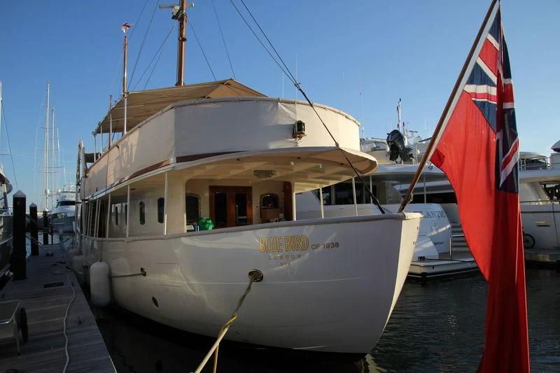a boat docked at a pier aboard BLUE BIRD OF 1938 Yacht for Sale