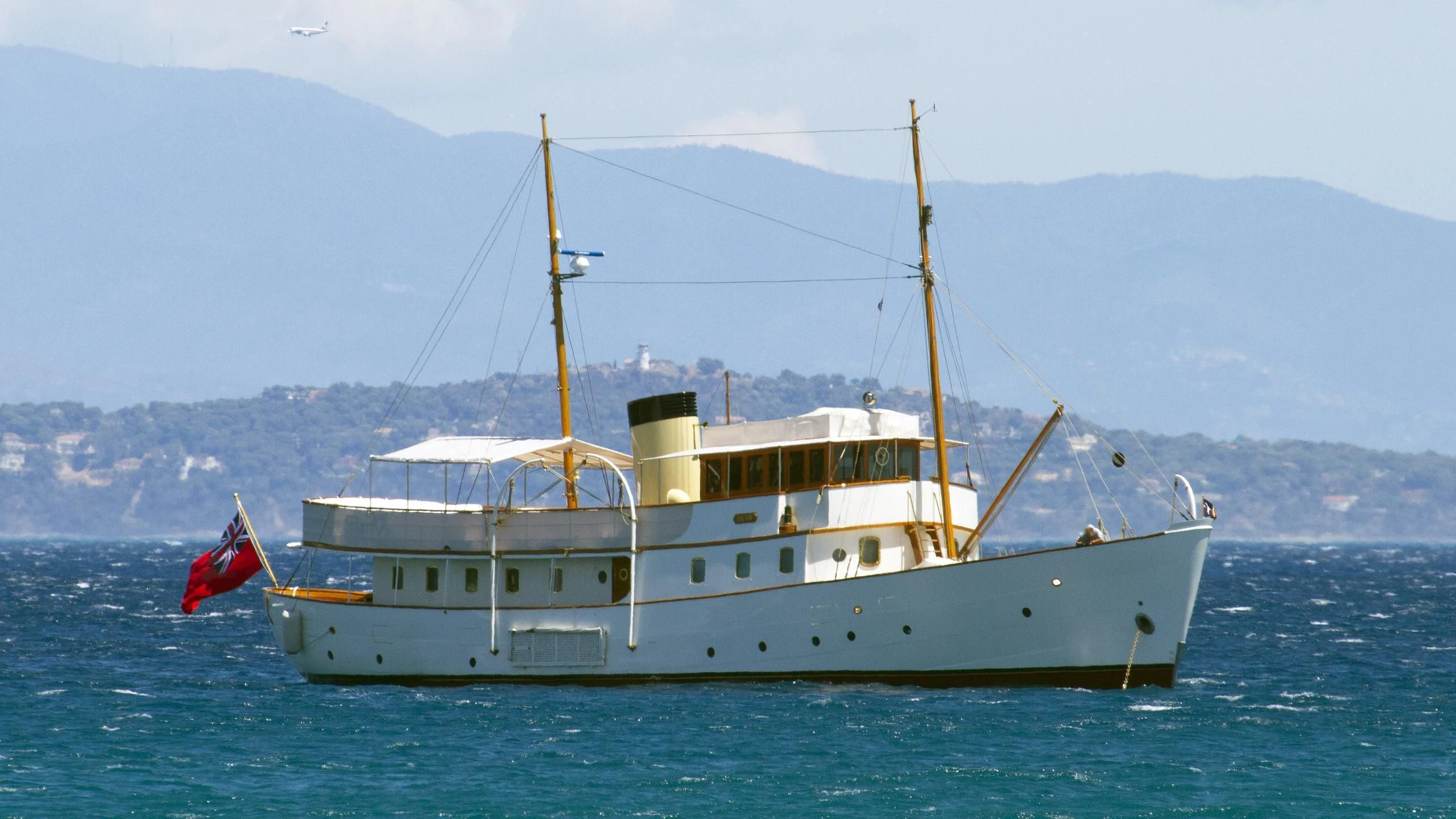 a large white boat in the water aboard BLUE BIRD OF 1938 Yacht for Sale