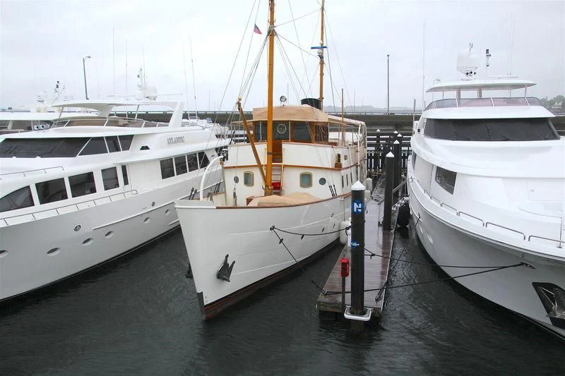 a group of boats are parked in a harbor aboard BLUE BIRD OF 1938 Yacht for Sale