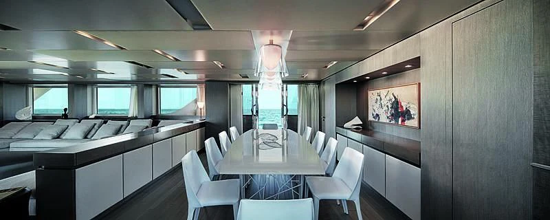 a room with a table chairs and a large window aboard RUSCELLO Yacht for Sale
