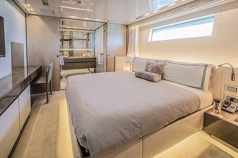 a bedroom with a bed and a piano aboard RUSCELLO Yacht for Sale