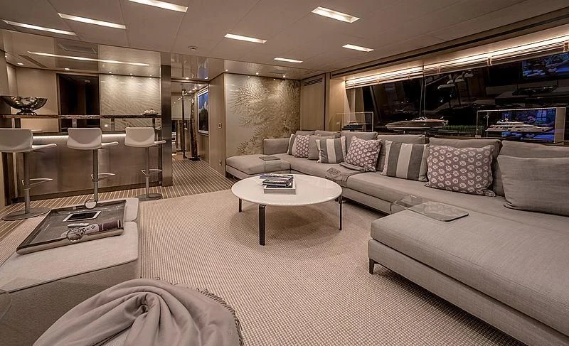 a living room with a couch and a table aboard RUSCELLO Yacht for Sale