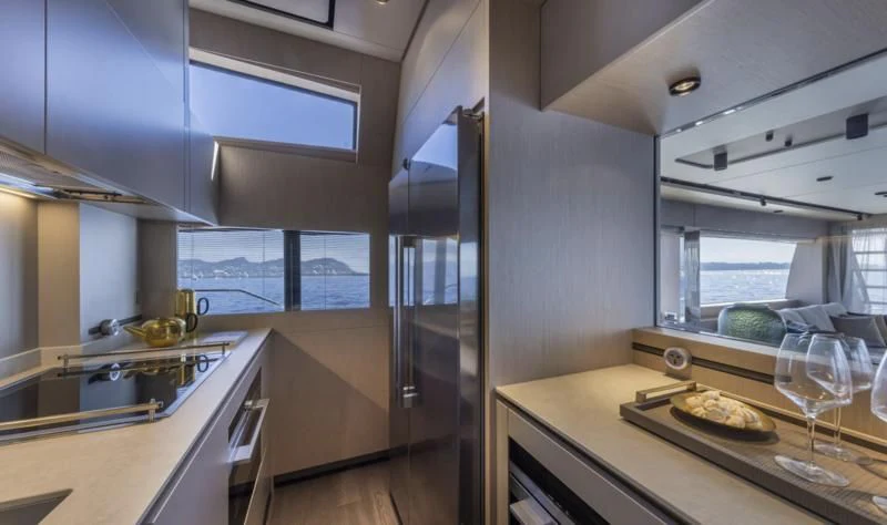 a kitchen with a sink and cabinets aboard FERRETTI 780/41 Yacht for Sale