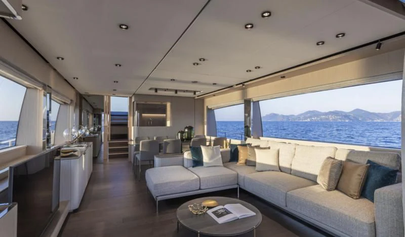 a living room with a large window aboard FERRETTI 780/41 Yacht for Sale