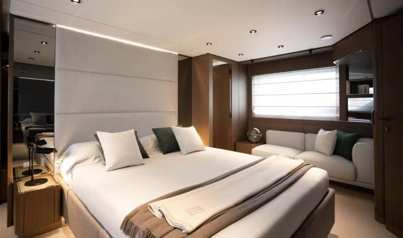 a room with a bed and a couch aboard FERRETTI 780/41 Yacht for Sale