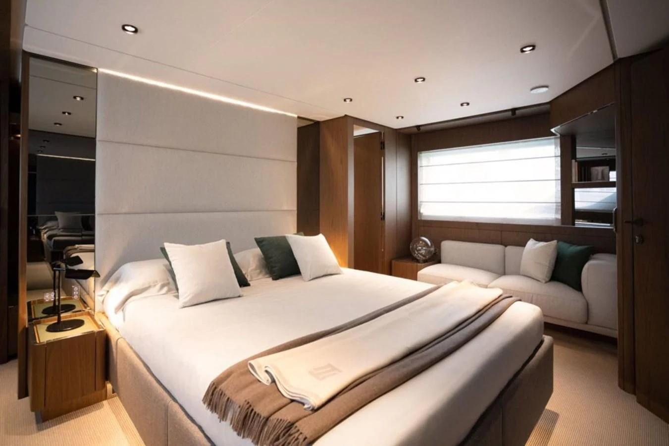 a room with a bed and a couch aboard FERRETTI 780/41 Yacht for Sale