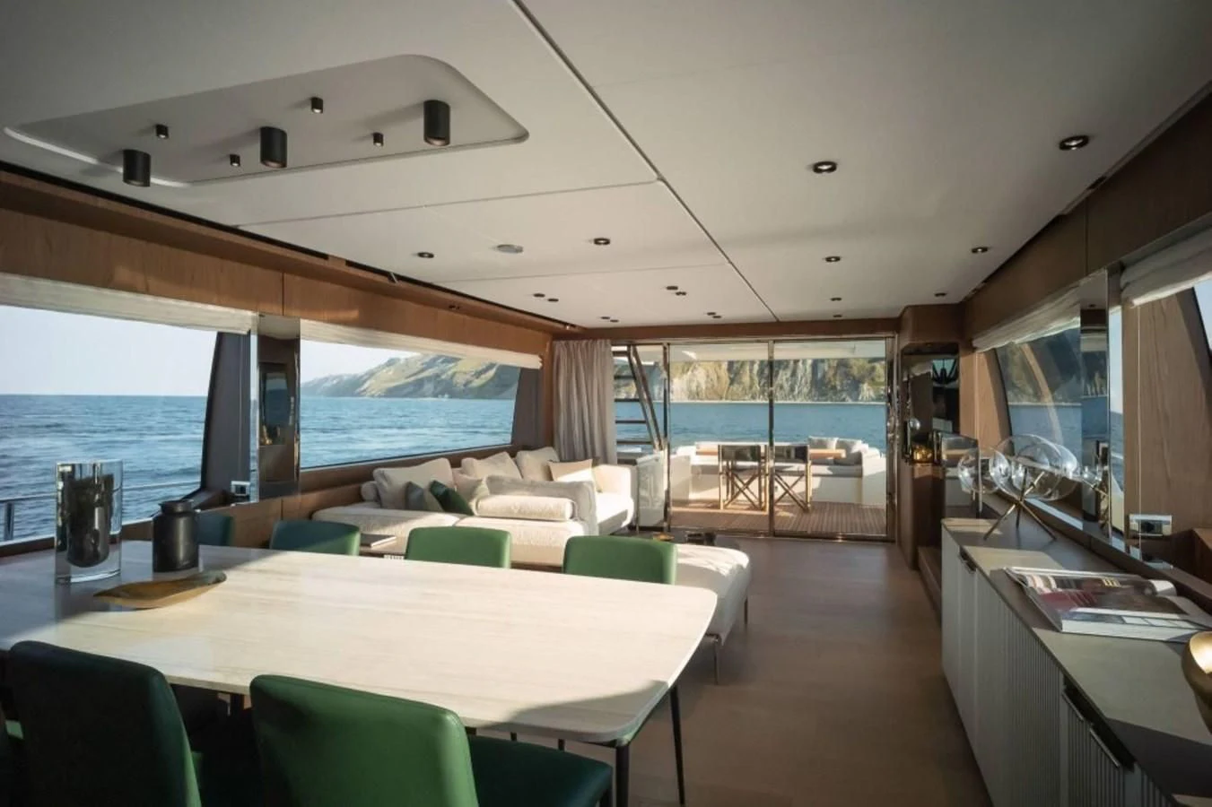 a room with a table and chairs aboard FERRETTI 780/41 Yacht for Sale