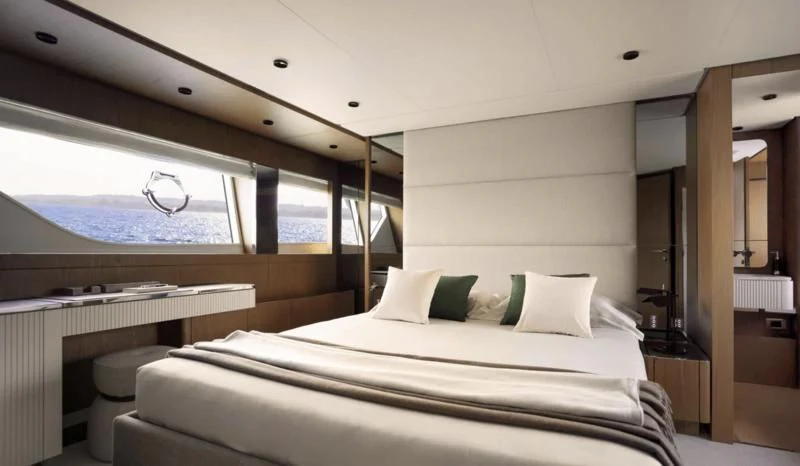 a room with a bed and a desk aboard FERRETTI 780/41 Yacht for Sale