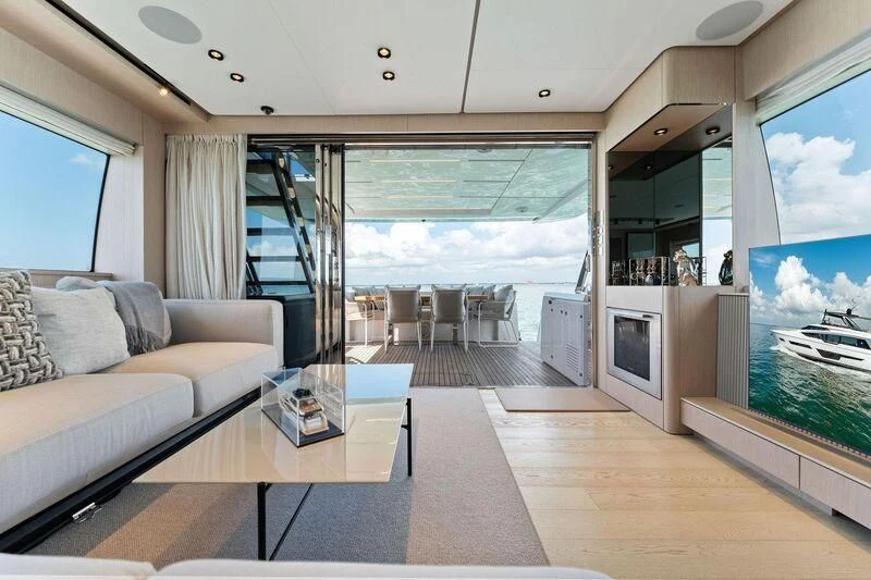 a living room with a large window aboard FERRETTI 780/41 Yacht for Sale