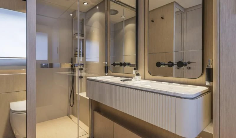 a bathroom with a large mirror aboard FERRETTI 780/41 Yacht for Sale