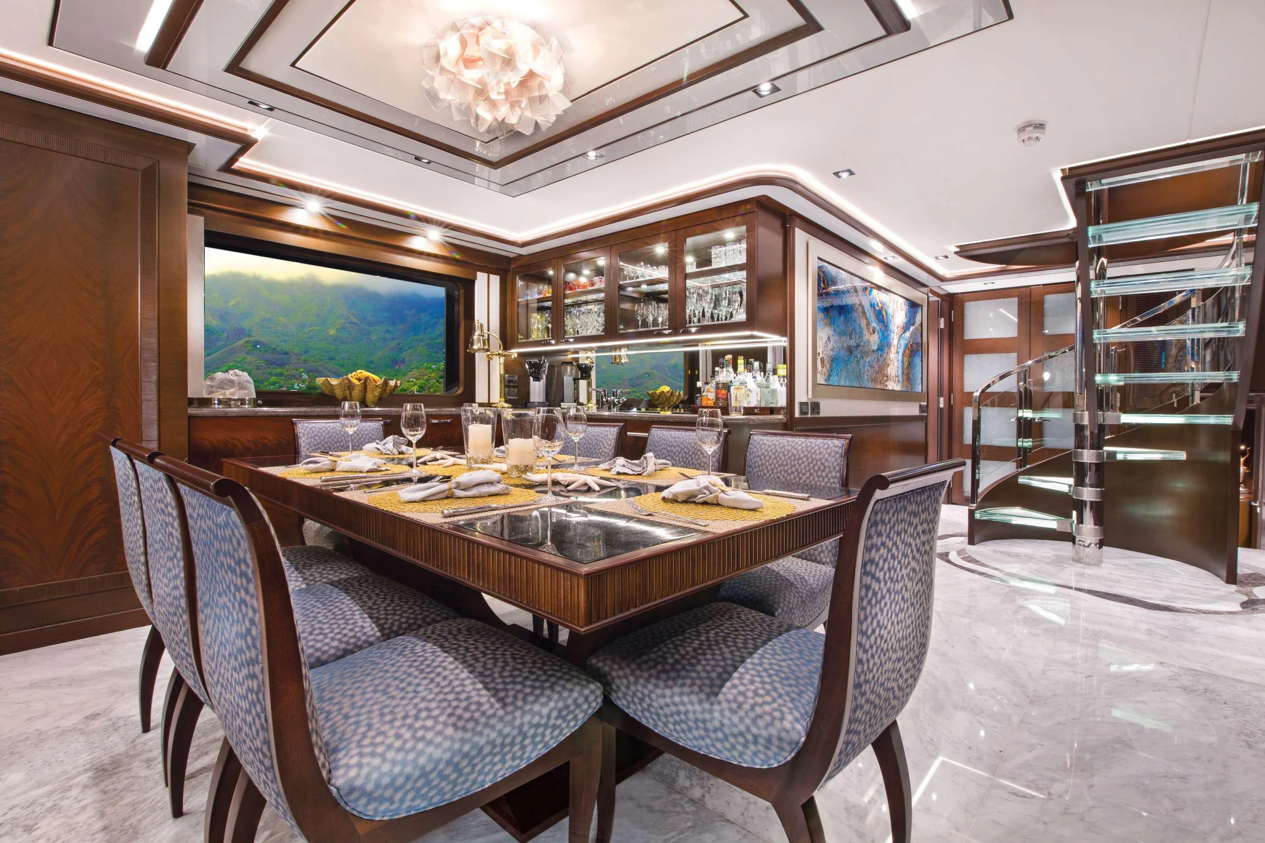a large dining table in a room aboard VIVIERAE II Yacht for Sale
