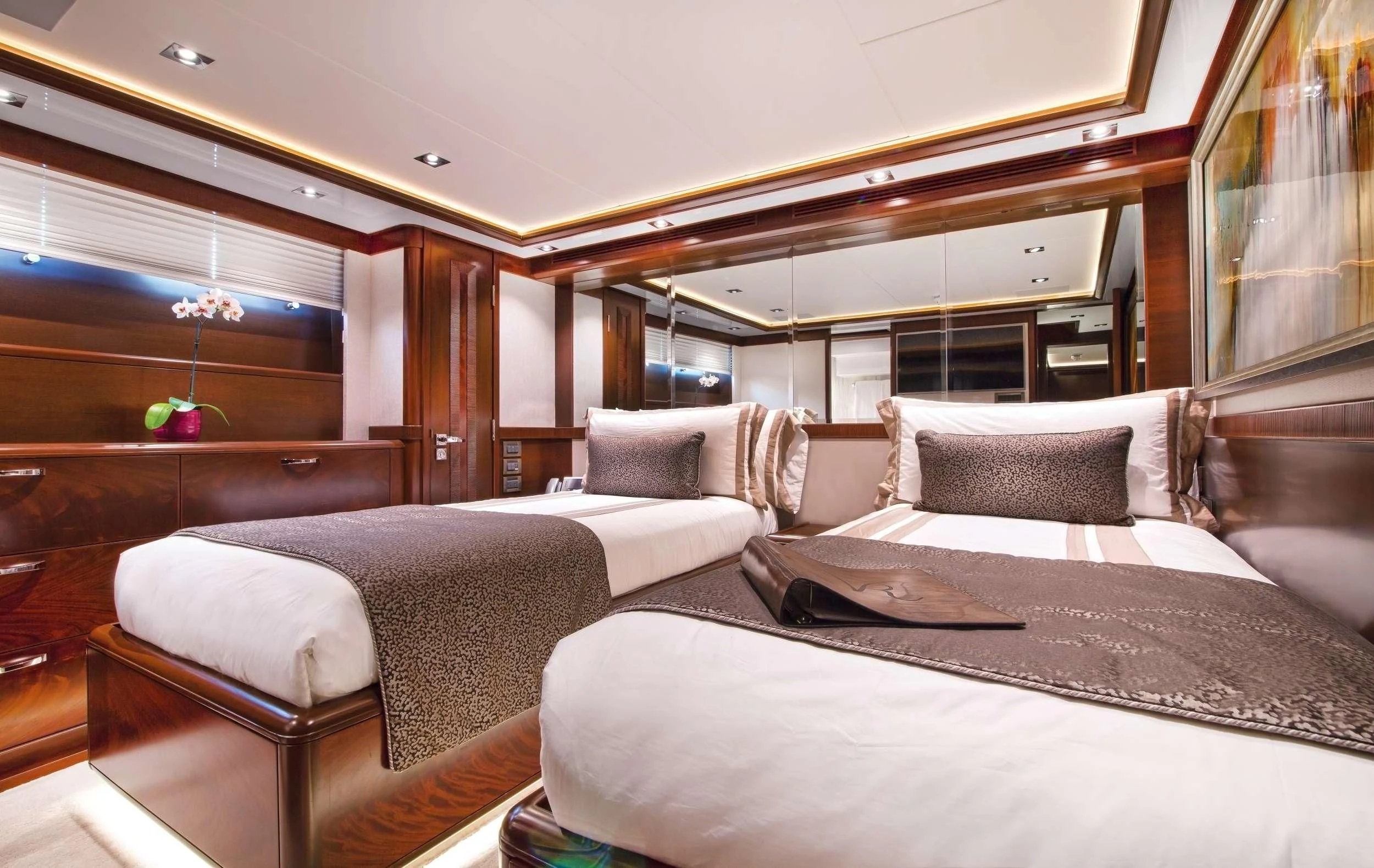 a room with a bed and a couch aboard VIVIERAE II Yacht for Sale