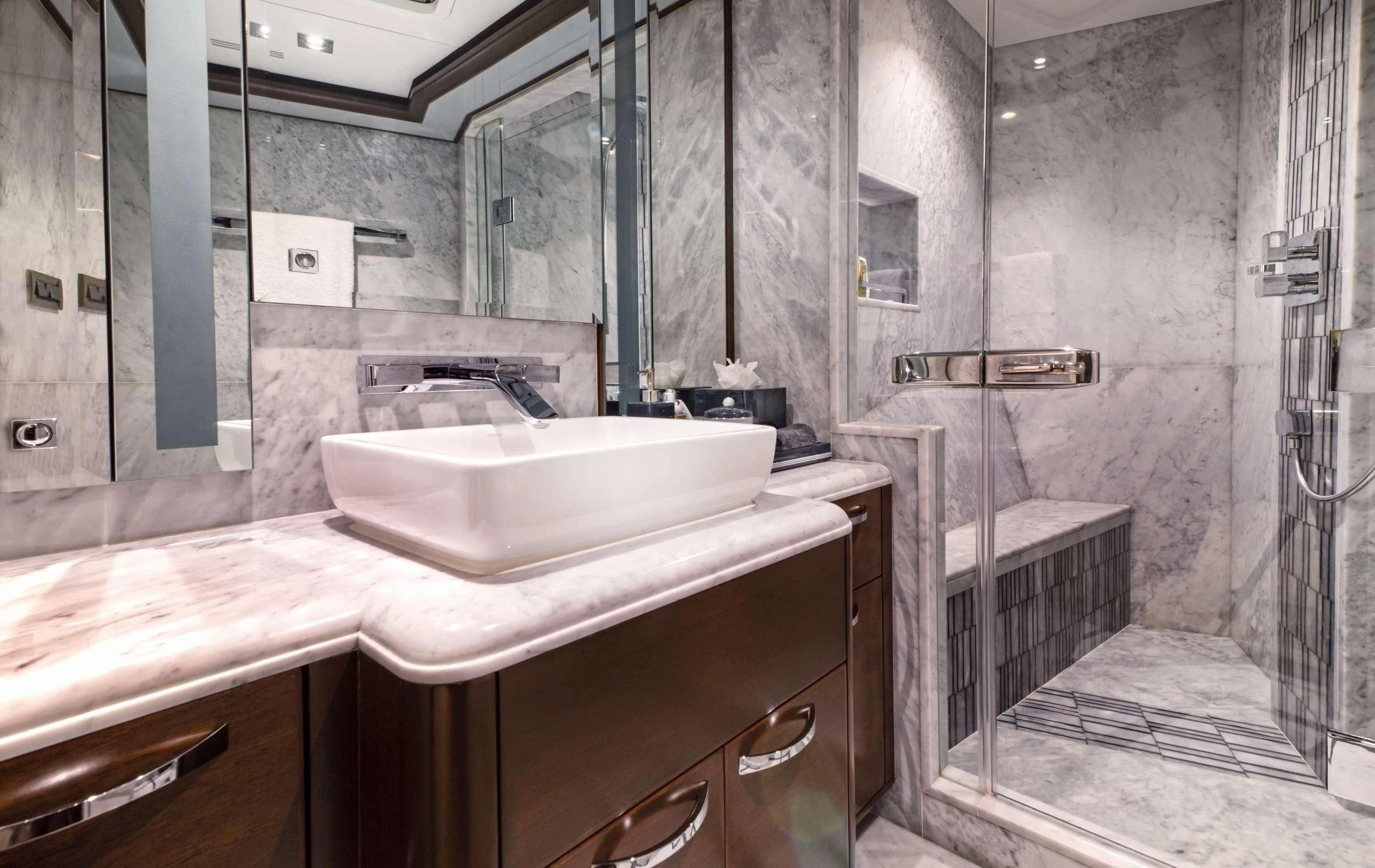 a bathroom with a sink and a mirror aboard VIVIERAE II Yacht for Sale